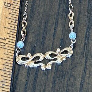 Vintage AVON Goldtone Moments Swirl design with faux pearls